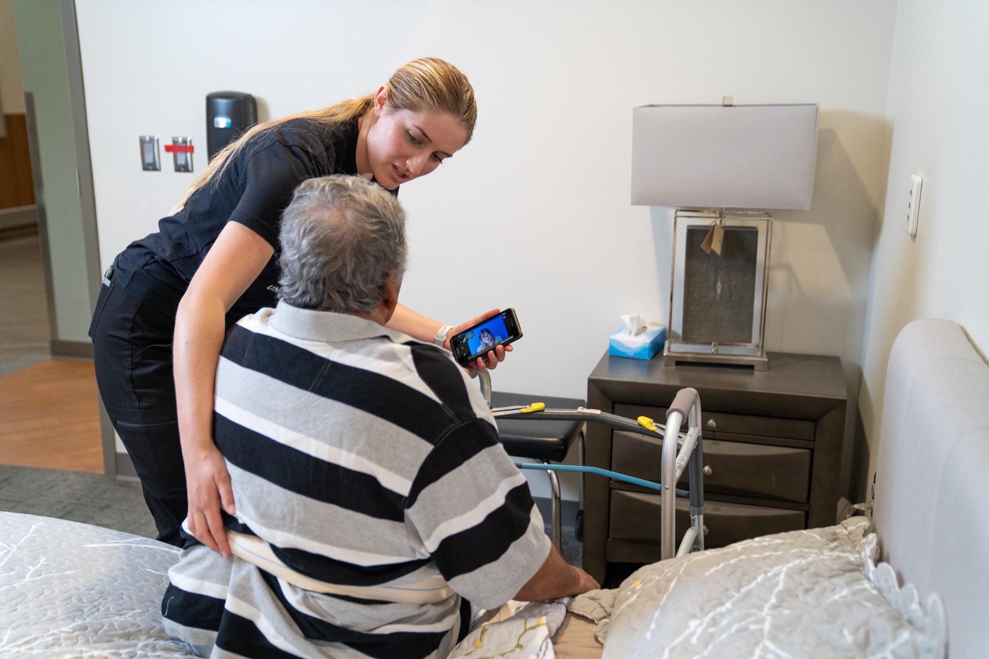 A person in a wheelchair in an accessible apartment living room